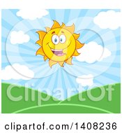 Clipart Of A Yellow Summer Time Sun Character Mascot Over A Hilly Landscape Royalty Free Vector Illustration