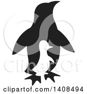Poster, Art Print Of Silhouetted Chick And Black Adult Penguin