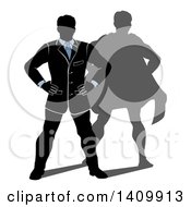 Poster, Art Print Of Black White And Blue Silhouetted Business Man Standing With His Hands On His Hips And A Super Hero Shadow
