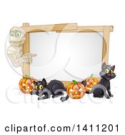 Poster, Art Print Of Halloween Mummy Pointing To A White Board Sign With Pumpkins And Black Cats