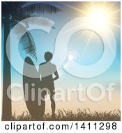 Poster, Art Print Of Silhouetted Male Surfer With A Board By A Palm Tree Against A Sunset