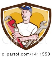 Clipart Of A Retro Cartoon White Male Plumber Mechanic Or Handyman Holding Monkey And Spanner Wrenches In Folded Arms In A Brown White And Yellow Shield Royalty Free Vector Illustration
