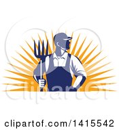 Retro Male Farmer Or Worker Standing With One Hand In His Pocket And One Hand Holding A Pitchfork Over An Orange Sun Burst