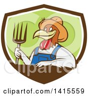 Poster, Art Print Of Retro Cartoon Farmer Rooster Chicken Man Wearing Overalls And A Straw Hat Holding A Pitchfork In A Brown White And Green Shield
