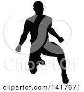 Clipart Of A Black Silhouetted Male Soccer Player In Action Royalty Free Vector Illustration