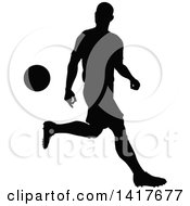 Poster, Art Print Of Black Silhouetted Male Soccer Player In Action