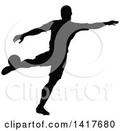 Clipart Of A Black Silhouetted Male Soccer Player In Action Royalty Free Vector Illustration