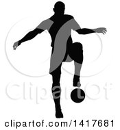 Poster, Art Print Of Black Silhouetted Male Soccer Player In Action