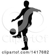 Poster, Art Print Of Black Silhouetted Male Soccer Player In Action