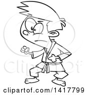 Clipart Of A Cartoon Black And White Karate Boy In A Fighting Stance Royalty Free Vector Illustration