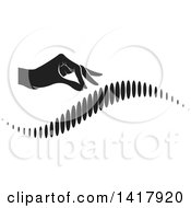 Clipart Of A Black And White Hand Over A Human Spine Royalty Free Vector Illustration by Lal Perera