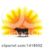 Poster, Art Print Of Silhouetted Cow Against A Sunset