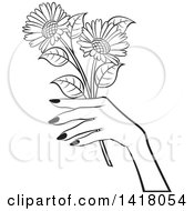 Poster, Art Print Of Black And White Womans Hand Holding Flowers