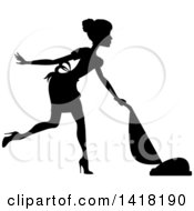 Clipart Of A Black Silhouetted Female Maid With Her Hair In A Bun Vacuuming Royalty Free Vector Illustration