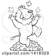 Cartoon Clipart Of A Black And White Lineart Happy Lion Playing In Autumn Leaves Royalty Free Vector Illustration