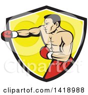 Poster, Art Print Of Retro Muscular Male Boxer Jabbing In A Black White And Yellow Shield