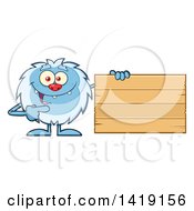 Clipart Of A Cartoon Yeti Abominable Snowman Pointing To A Blank Wood Sign Royalty Free Vector Illustration