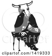 Clipart Of A Black And White Woodcut Minotaur Sitting In A Chair Royalty Free Vector Illustration