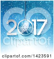 Clipart Of A 2017 Happy New Year Greeting With A Hanging Bauble Over Blue Snow And Snowflakes Royalty Free Vector Illustration