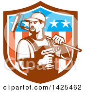 Clipart Of A Retro Handyman Holding A Paint Roller Over His Shoulder And A Cordless Drill In Hand Emerging From An American Themed Shield Royalty Free Vector Illustration by patrimonio