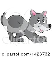 Clipart Of A Cartoon Playful Gray Wolf Royalty Free Vector Illustration by visekart
