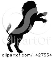 Clipart Of A Black Silhouetted Male Lion Rearing And Attacking Royalty Free Vector Illustration