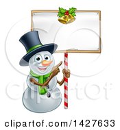 Poster, Art Print Of Happy Christmas Snowman Wearing A Top Hat And Pointing To A Blank Sign