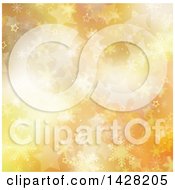 Clipart Of A Golden And Orange Christmas Winter Background Of Snowflakes And Stars Royalty Free Illustration