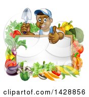 Poster, Art Print Of Happy Black Male Gardener In Blue Holding Up A Garden Shovel And Giving A Thumb Up Over A Blank White Sign With Produce