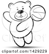 Clipart Of A Black And White Bear Playing With A Ball Royalty Free Vector Illustration
