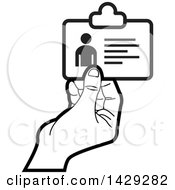 Clipart Of A Black And White Hand Holding An Id Card Royalty Free Vector Illustration