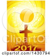 Poster, Art Print Of Silhouetted Cross Against A Sunset With Sparkles Stars And A Swirl With New Year 2017