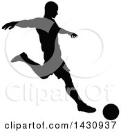 Clipart Of A Black Silhouetted Male Soccer Player Kicking Royalty Free Vector Illustration