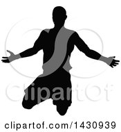 Clipart Of A Black Silhouetted Male Soccer Player Royalty Free Vector Illustration