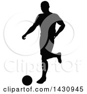 Poster, Art Print Of Black Silhouetted Male Soccer Player Kicking