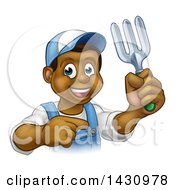 Poster, Art Print Of Cartoon Happy Black Male Gardener In Blue Holding A Garden Fork And Pointing