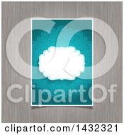 Clipart Of A White Frame Over A Blue Ornate Floral Invite On Wood Royalty Free Vector Illustration