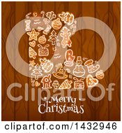 Clipart Of A Merry Christmas Greeting And Stocking Formed Of Gingerbread Cookies Over Wood Royalty Free Vector Illustration by Vector Tradition SM