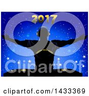 Clipart Of A Silhouetted Male DJ Holding His Arms Up Wearing A Happy New Year Shirt Over Record Decks With 2017 Over Blue And Stars Royalty Free Vector Illustration