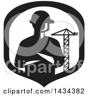 Retro Silhouetted Builder Engineer Or Foreman With Folded Arms In A A Shield With A Construction Crane