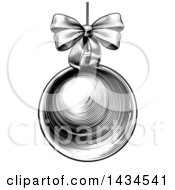Poster, Art Print Of Black And White Vintage Woodcut Or Engraved Suspended Christmas Bauble Ornament With A Bow