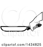 Clipart Of A Black And White Hand Gripping A Frying Pan Handle Royalty Free Vector Illustration