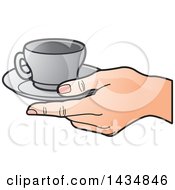 Hand Holding A Gray Tea Cup And Saucer
