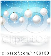 Backgound Of 3d Suspended White Christmas Baubles Over A Winter Landscape And Blue Sky