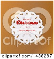 Clipart Of A Taped Merry Christmas And Happy New Year Greeting Paper Snowflake Over Brown Paper Royalty Free Vector Illustration