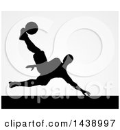 Poster, Art Print Of Black Silhouetted Male Soccer Player Kicking Over Gray