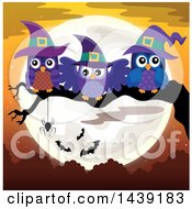 Group Of Witch Owls On A Tree Branch Against A Full Moon