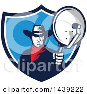 Clipart Of A Retro Cowboy Holding And Aiming A Satellite Dish In A Crest Royalty Free Vector Illustration