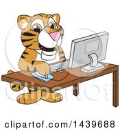 Tiger Cub School Mascot Character Using A Computer
