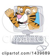 Clipart Of A Tiger Cub School Mascot Character Emerging From A Computer Screen Royalty Free Vector Illustration